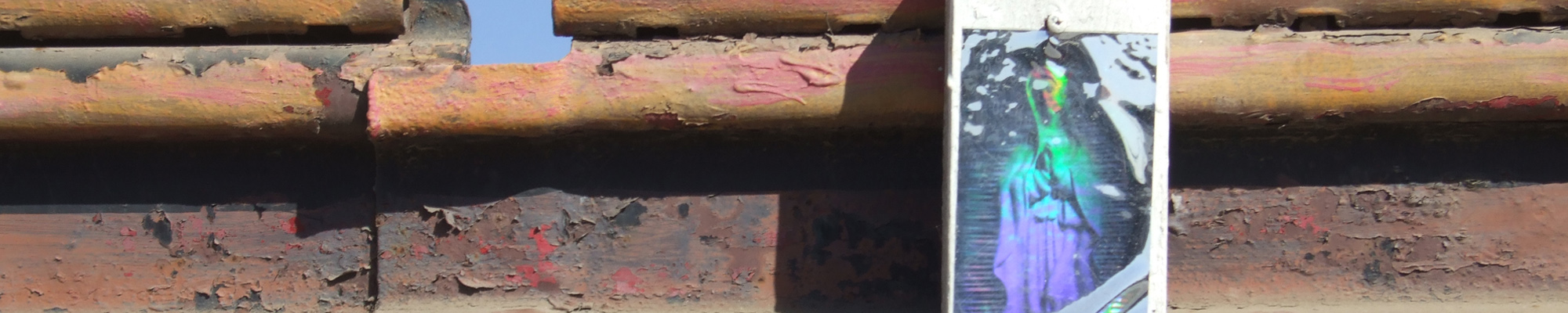 upclose of border fence with Madonna